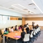 people having meeting inside conference room