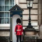 royal guard standing near lamp post